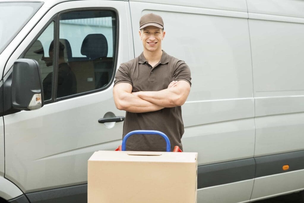 Folded-arms-man-front-of-van